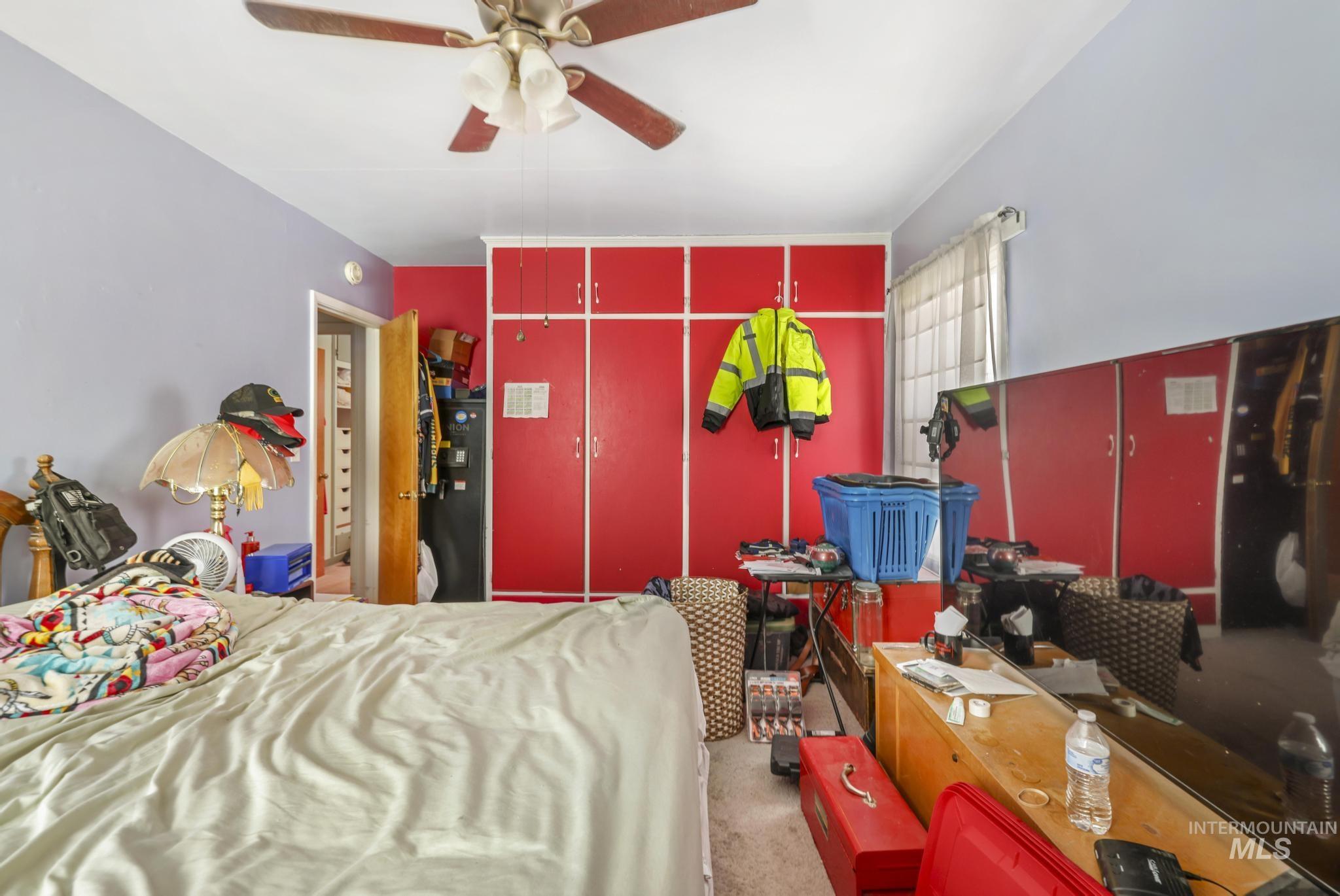 818 Union Avenue Filer, ID 83328 - Photo 11 of 20 Bedroom with light colored carpet and ceiling fan