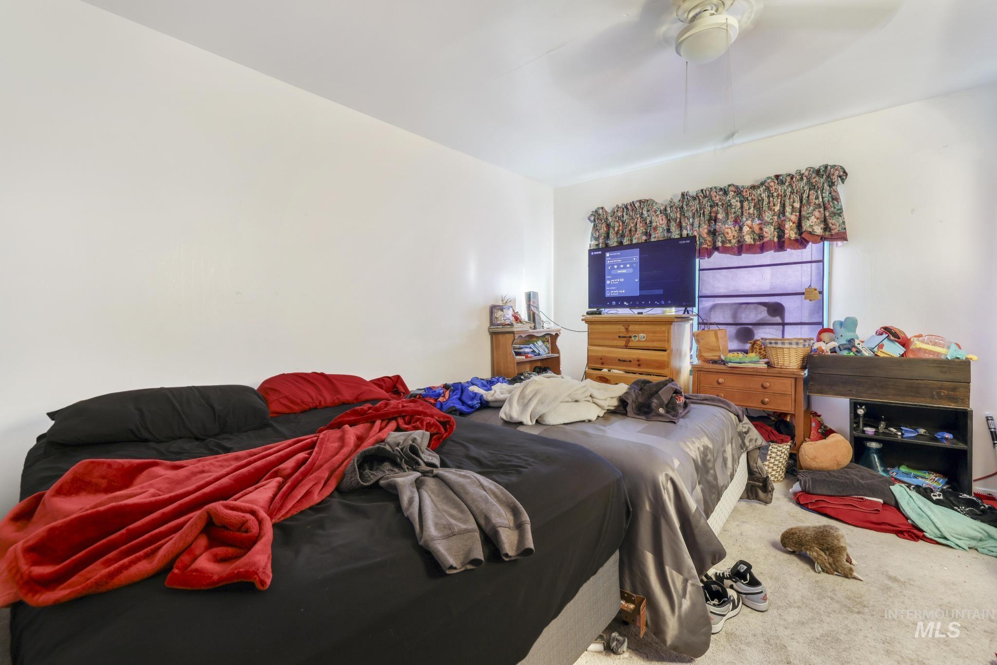 818 Union Avenue Filer, ID 83328 - Photo 12 of 20 Bedroom with carpet flooring and ceiling fan