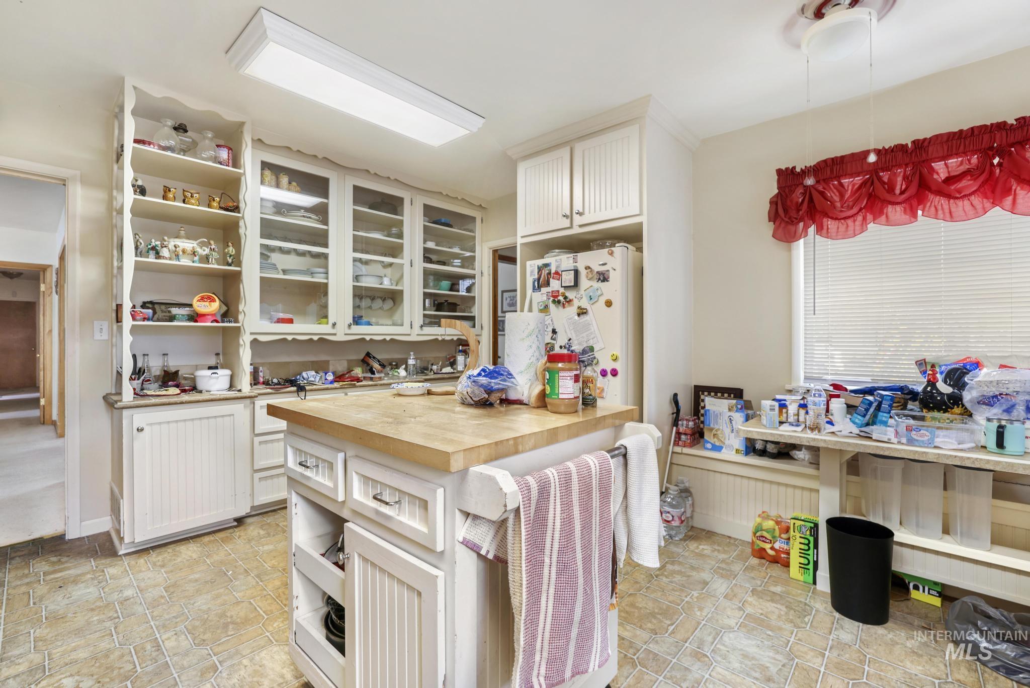 818 Union Avenue Filer, ID 83328 - Photo 5 of 20 Kitchen with butcher block countertops, open shelves, and white cabinets