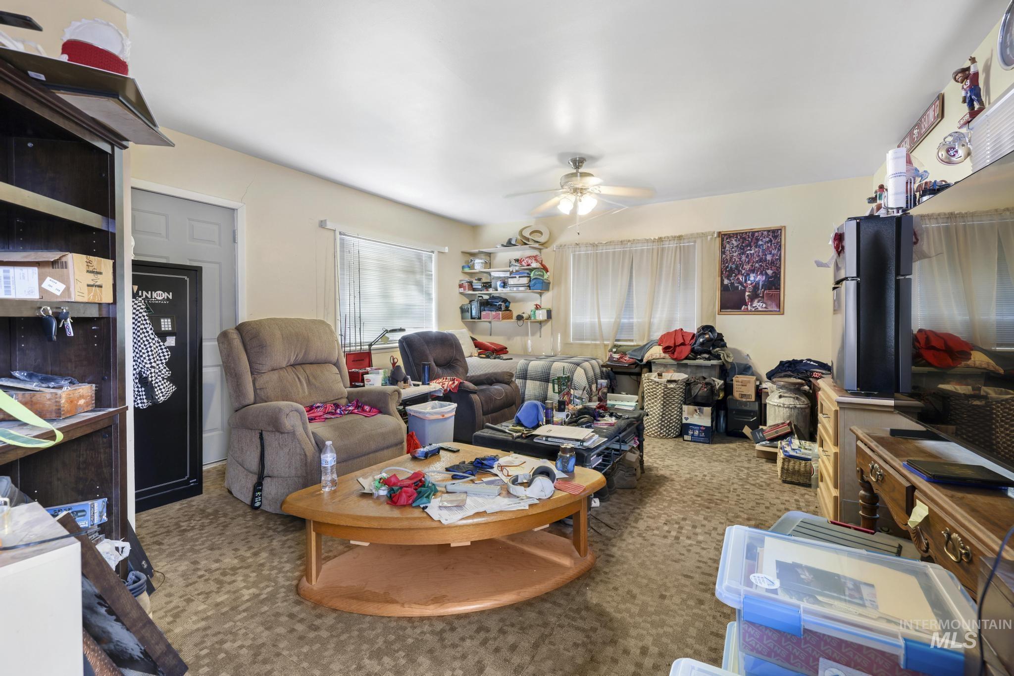 818 Union Avenue Filer, ID 83328 - Photo 6 of 20 Carpeted living area featuring a ceiling fan