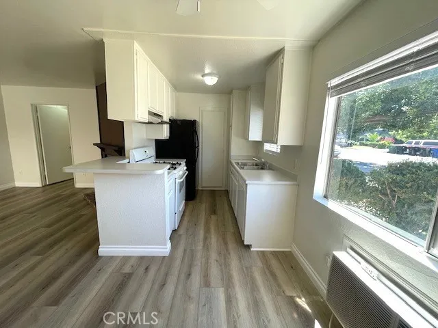 a kitchen that has a sink and a stove