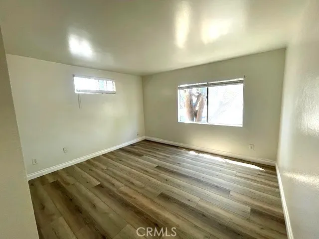 a bathroom with a granite countertop shower a toilet and a shower