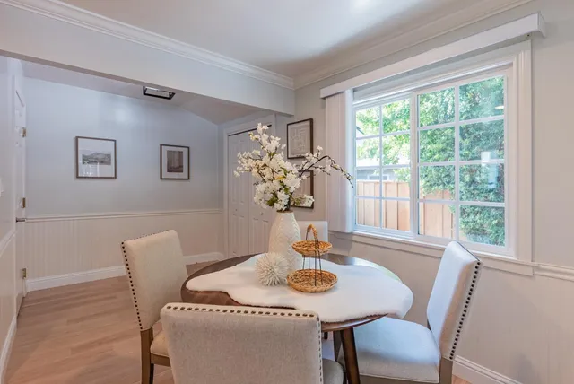 a view of a dining room with furniture window and outside view