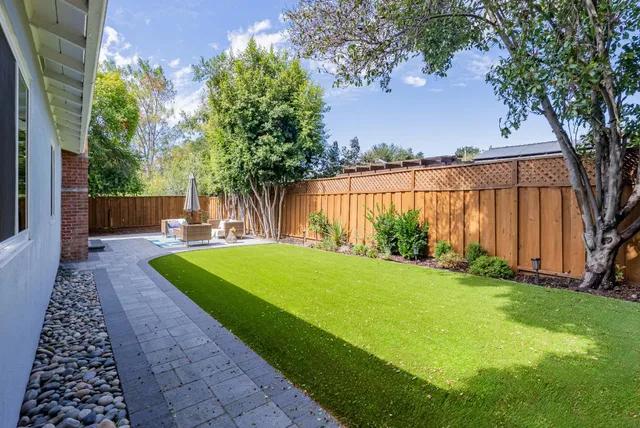a view of a backyard with a garden