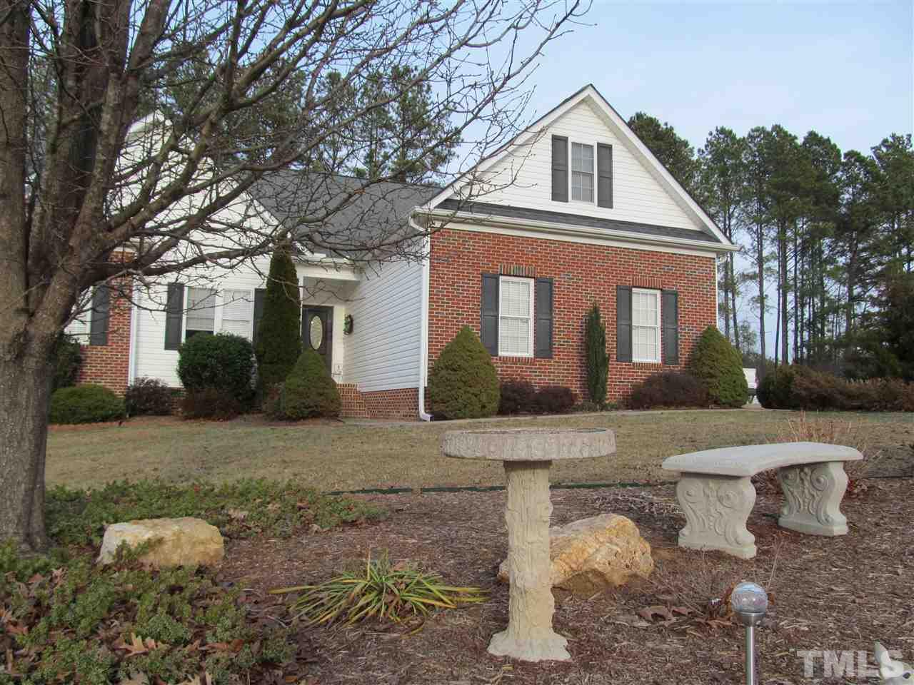 3540 Saddle Ridge Road Stem, NC 27581 - Photo 2 of 25 a front view of a house with garden