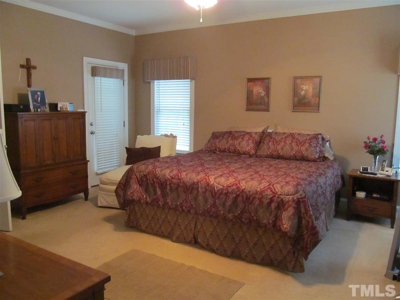 3540 Saddle Ridge Road Stem, NC 27581 - Photo 11 of 25 a bedroom with a bed and dresser