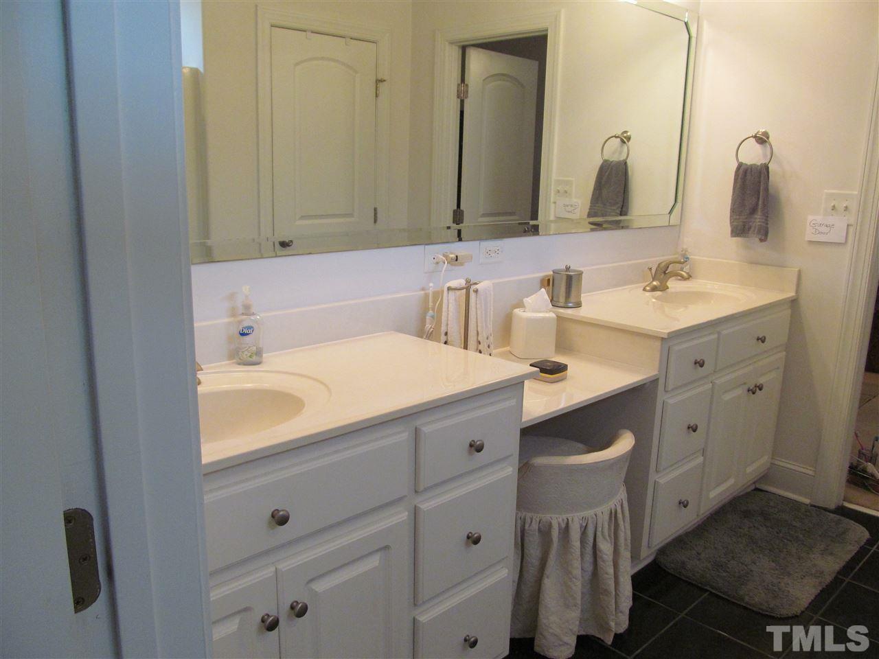 3540 Saddle Ridge Road Stem, NC 27581 - Photo 13 of 25 a bathroom with a sink and a mirror