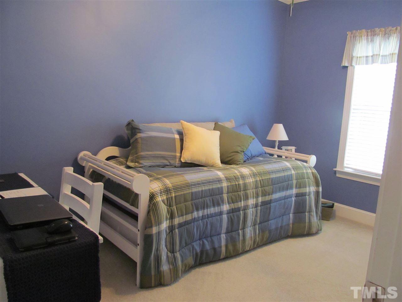 3540 Saddle Ridge Road Stem, NC 27581 - Photo 16 of 25 a bedroom with a bed and a window