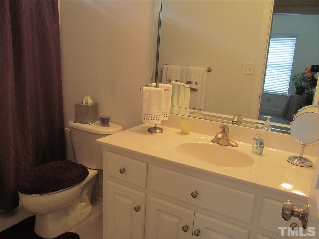 3540 Saddle Ridge Road Stem, NC 27581 - Photo 18 of 25 a bathroom with a sink and a toilet