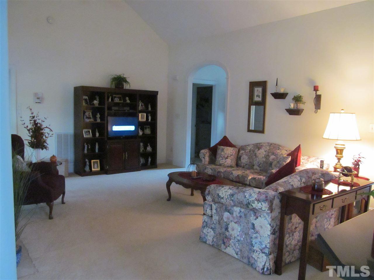 3540 Saddle Ridge Road Stem, NC 27581 - Photo 5 of 25 a living room with furniture and a fireplace