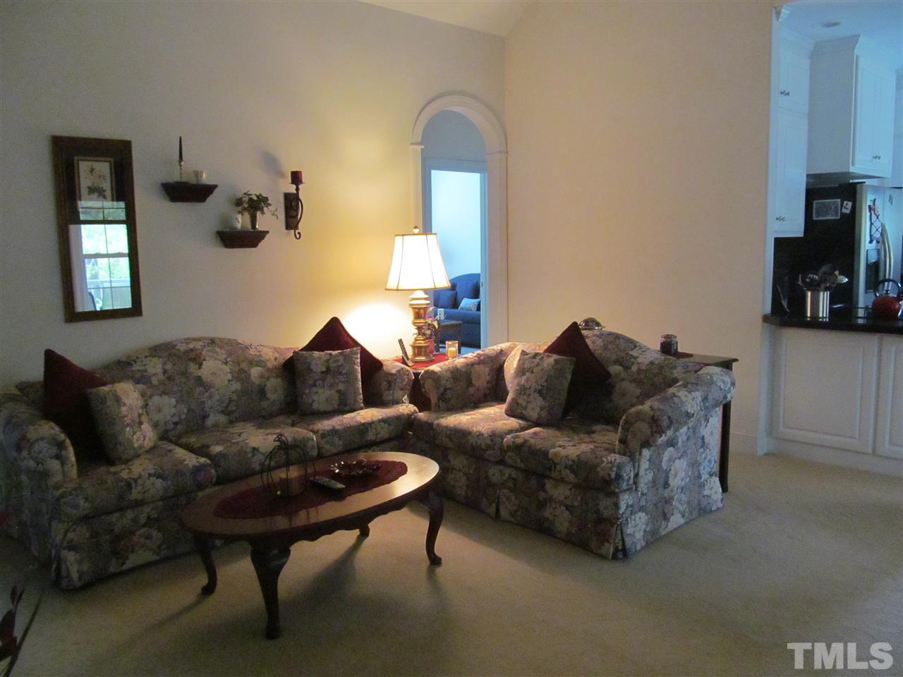3540 Saddle Ridge Road Stem, NC 27581 - Photo 6 of 25 a living room with a couch and a flat screen tv