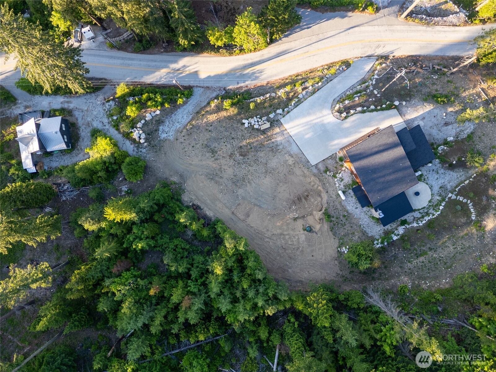 16063 Cedar Brae Road Leavenworth, WA 98826 - Photo 6 of 19 an aerial view of a house with a yard and a wooden bench