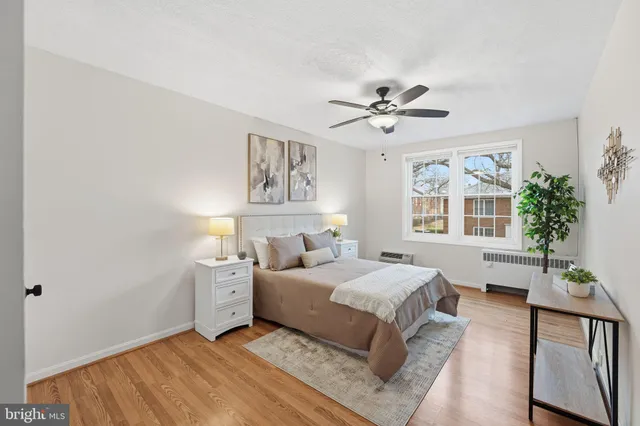 a bed room with a bed and a chandelier