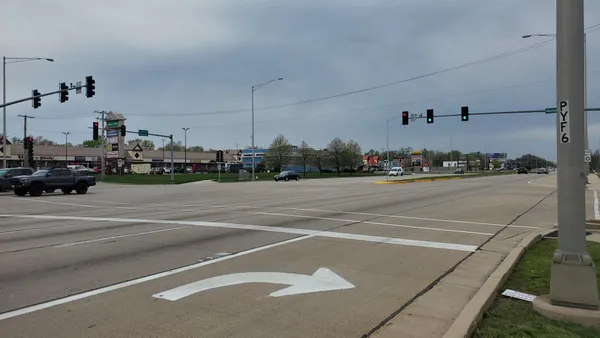 a view of a garden with a building in the background