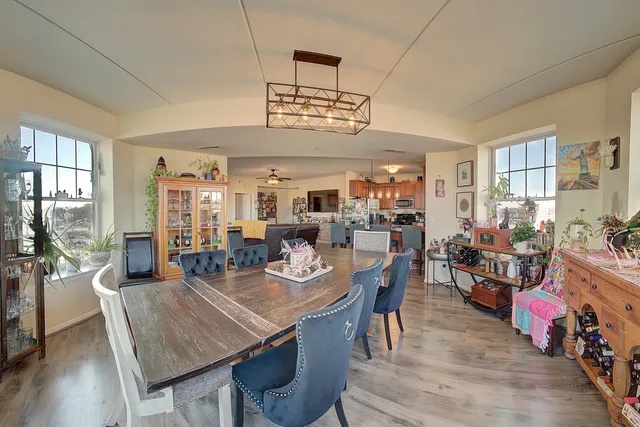 a view of a dining area with furniture window and wooden floor