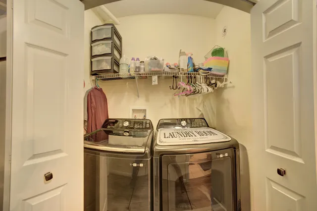 a kitchen with a stove and a refrigerator