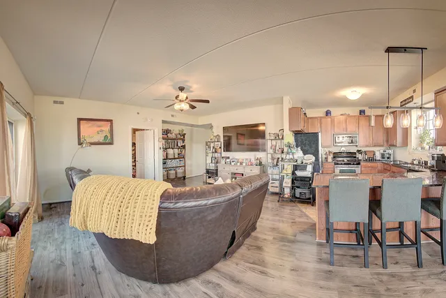 a living room with fireplace furniture and a flat screen tv