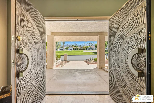 a view of a dining room with furniture window and outside view