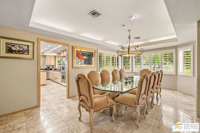 a view of a terrace with furniture and a patio