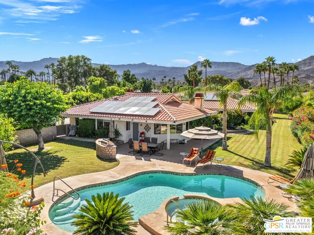 a view of a swimming pool with a patio