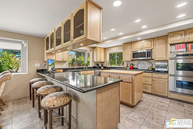 a view of a garden with a building in the background