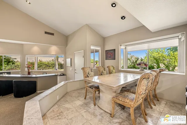 a spacious bathroom with a sink mirror and vanity