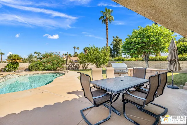 a kitchen with stainless steel appliances granite countertop a stove and a microwave