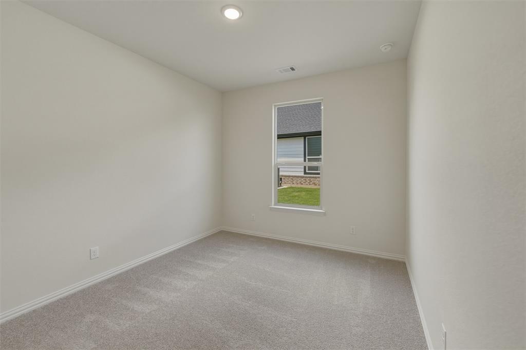 1217 Colca Drive Springtown, TX 76082 - Photo 11 of 25 Neutral painted walls featuring a single window and recessed lighting