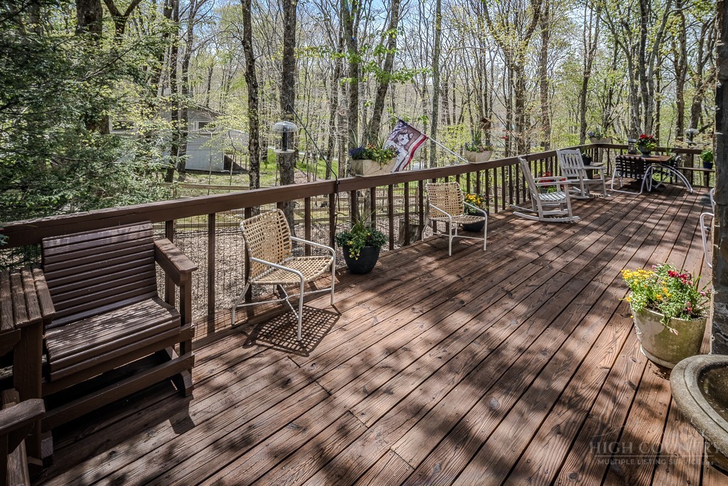 103-105 Upper Grouse Ridge Road Beech Mountain, NC 28604 - Photo 31 of 48 a view of a balcony with chairs