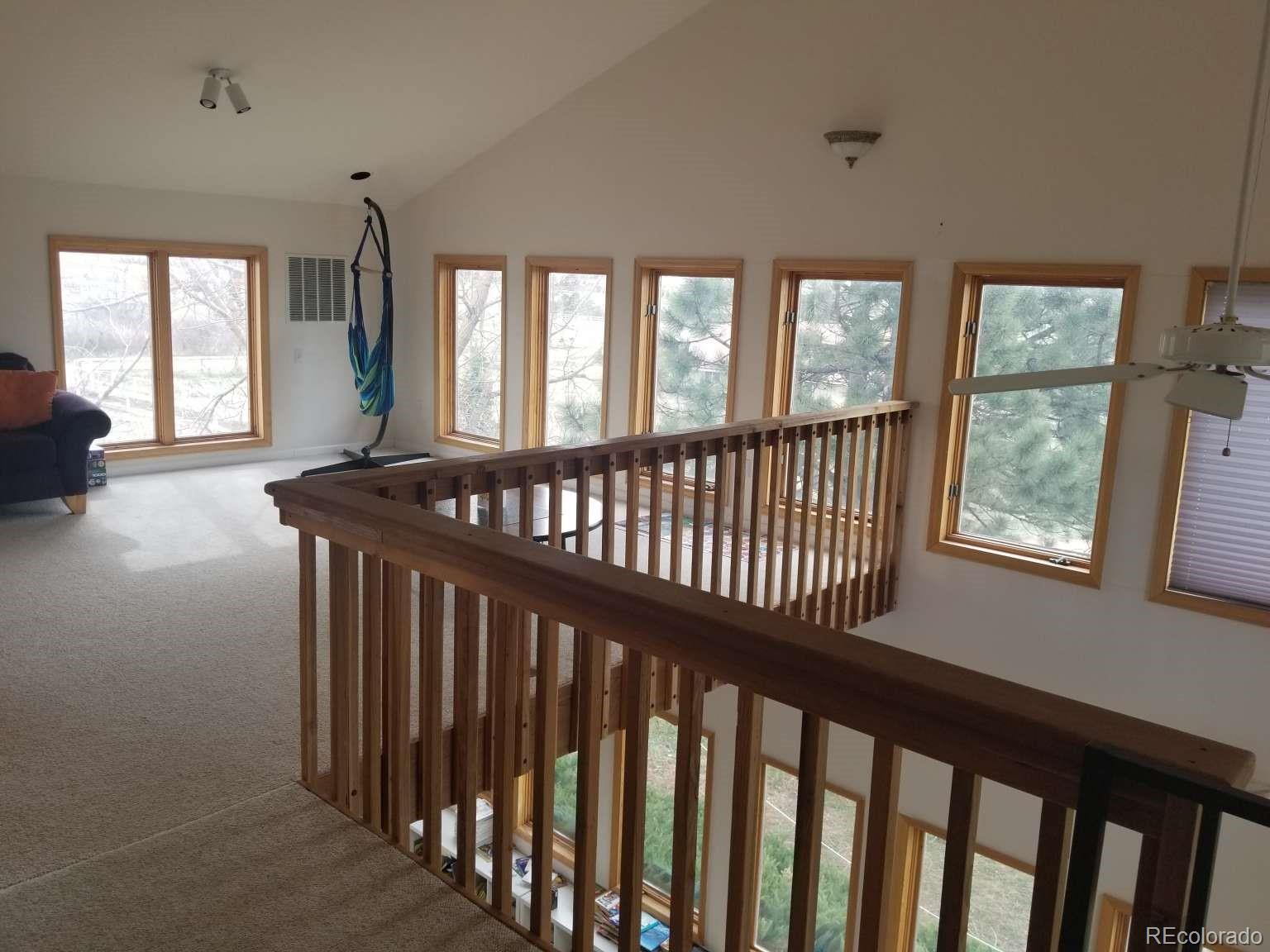 3800 Plateau Road Longmont, CO 80503 - Photo 8 of 12 a view of a porch with wooden floor