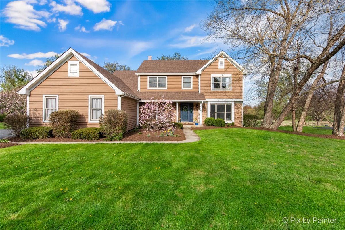 a front view of a house with a yard
