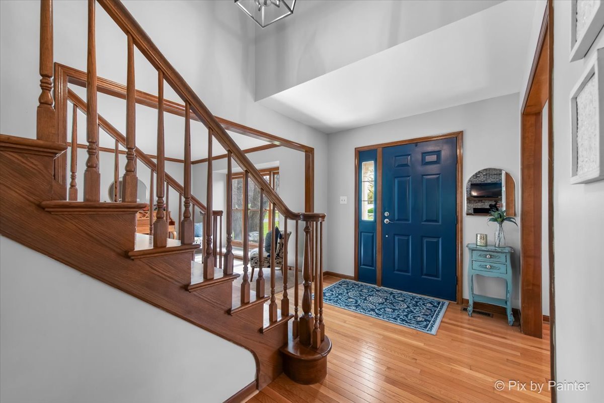 3910 Tecoma Drive Crystal Lake, IL 60012 - Photo 13 of 54 a view of entryway and hall with wooden floor