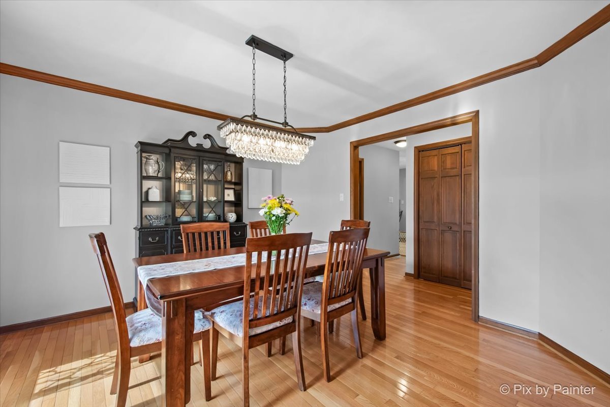 3910 Tecoma Drive Crystal Lake, IL 60012 - Photo 15 of 54 a view of a dining room with furniture window and wooden floor