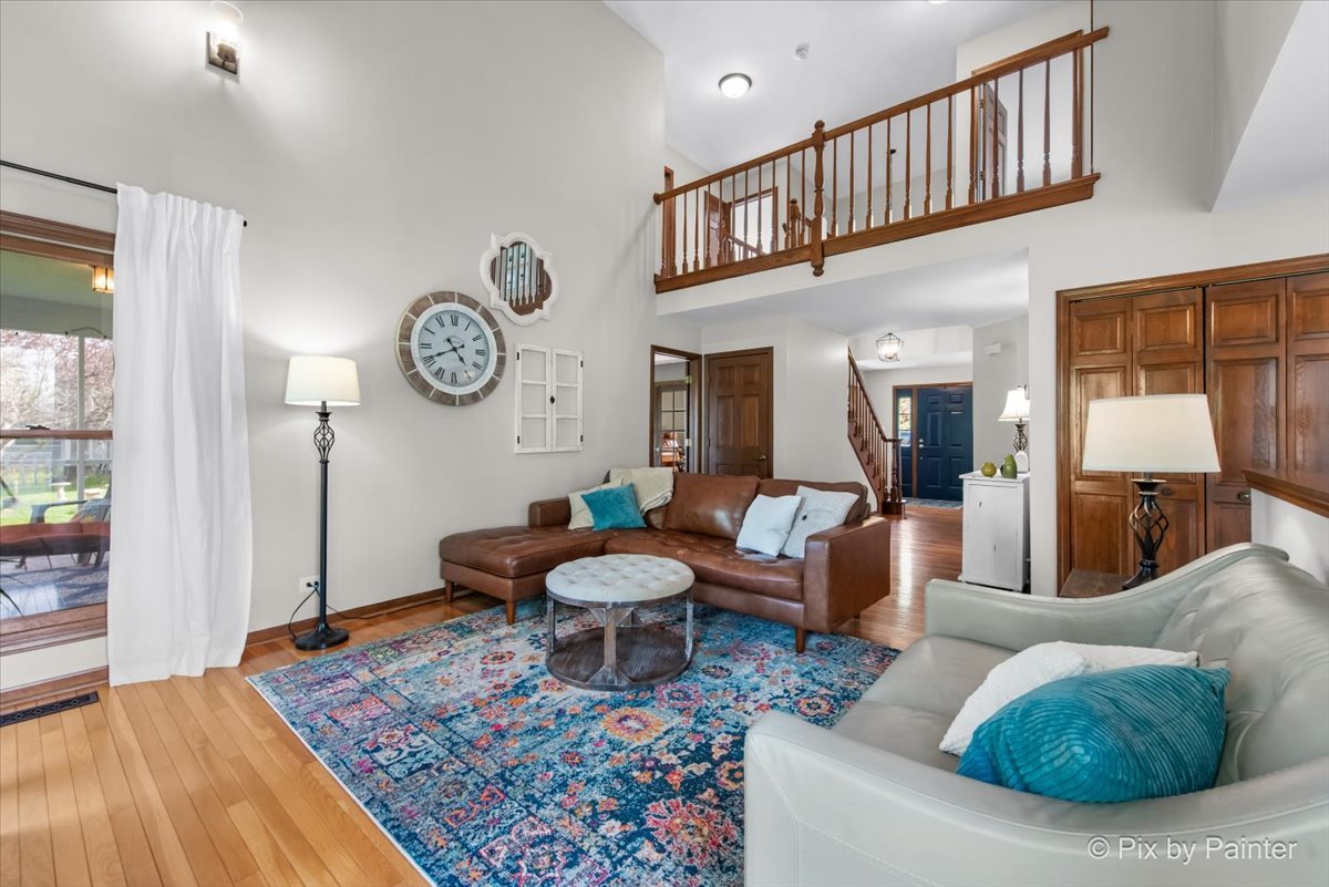 3910 Tecoma Drive Crystal Lake, IL 60012 - Photo 17 of 54 a living room with furniture a rug and a window
