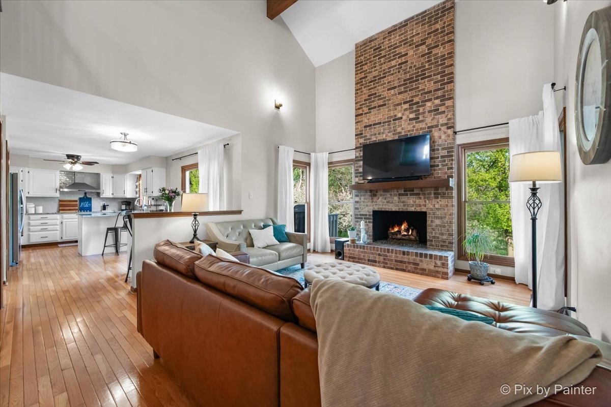 3910 Tecoma Drive Crystal Lake, IL 60012 - Photo 18 of 54 a living room with furniture wooden floor and a fireplace