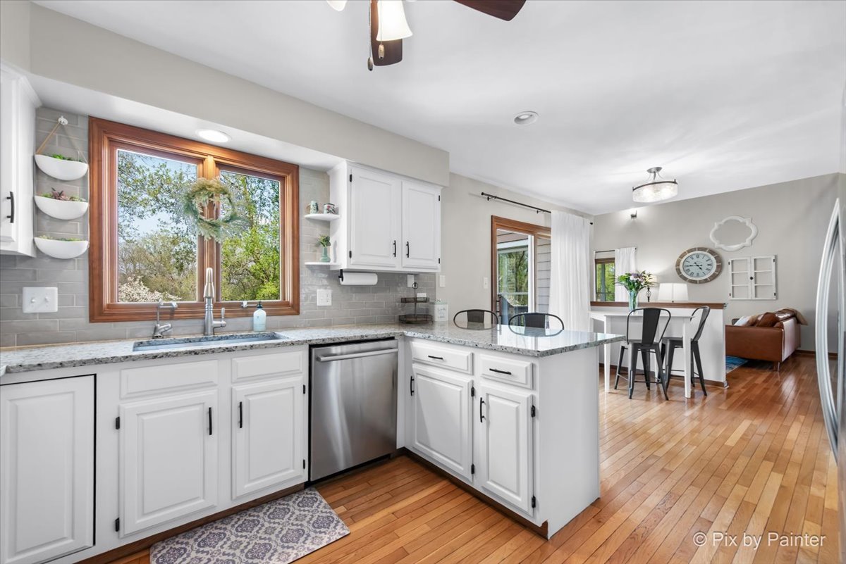 3910 Tecoma Drive Crystal Lake, IL 60012 - Photo 20 of 54 a open kitchen with white cabinets stove and sink