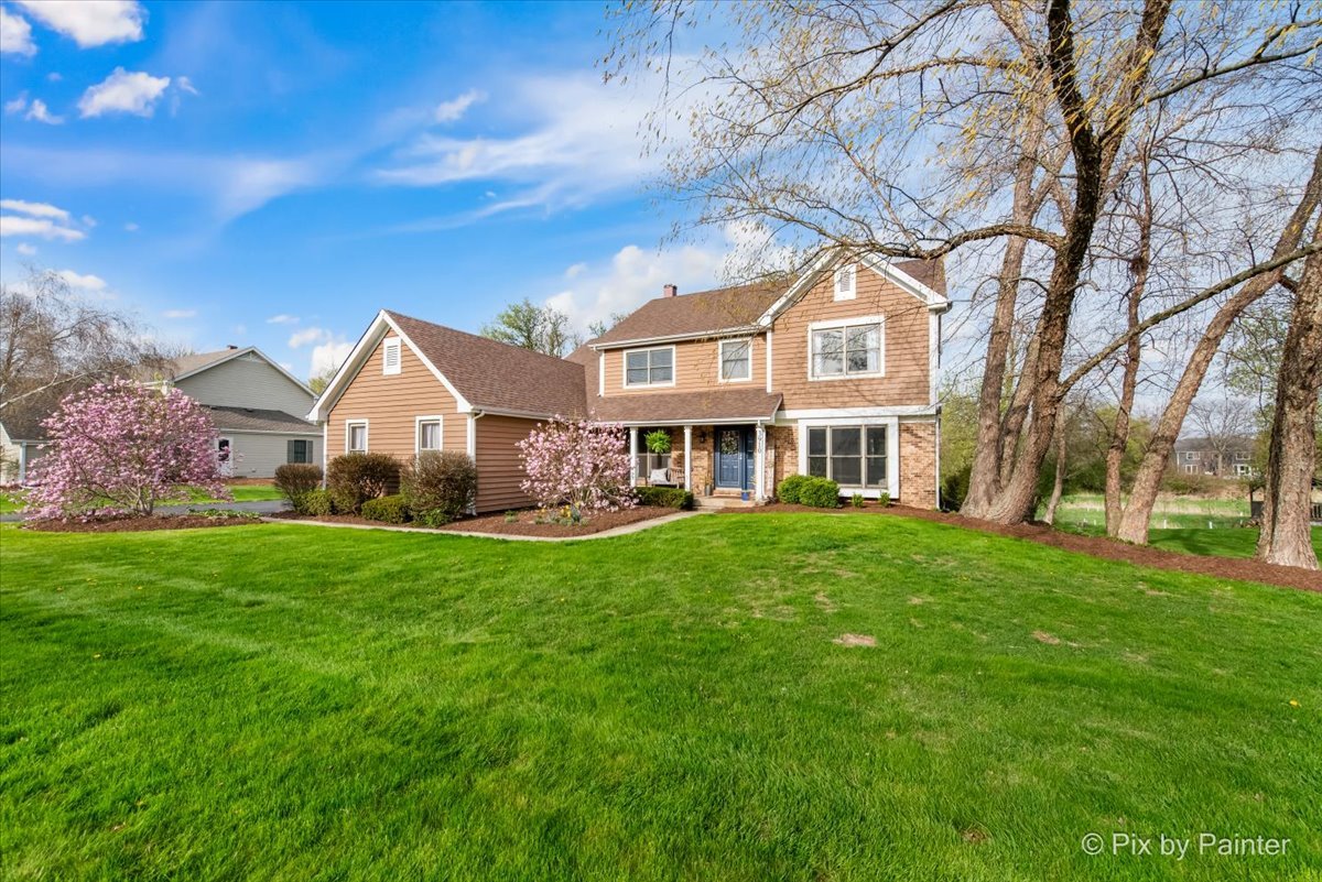 3910 Tecoma Drive Crystal Lake, IL 60012 - Photo 2 of 54 a front view of a house with yard and green space