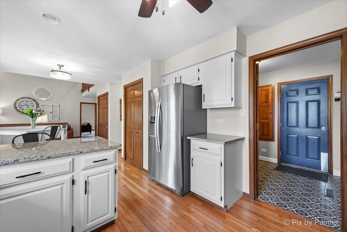 3910 Tecoma Drive Crystal Lake, IL 60012 - Photo 21 of 54 a kitchen with stainless steel appliances granite countertop a refrigerator and a sink