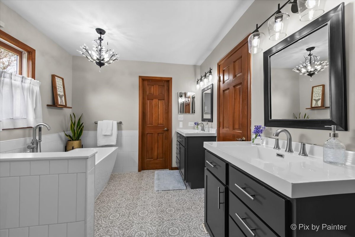 3910 Tecoma Drive Crystal Lake, IL 60012 - Photo 35 of 54 a spacious bathroom with a sink double vanity and a mirror
