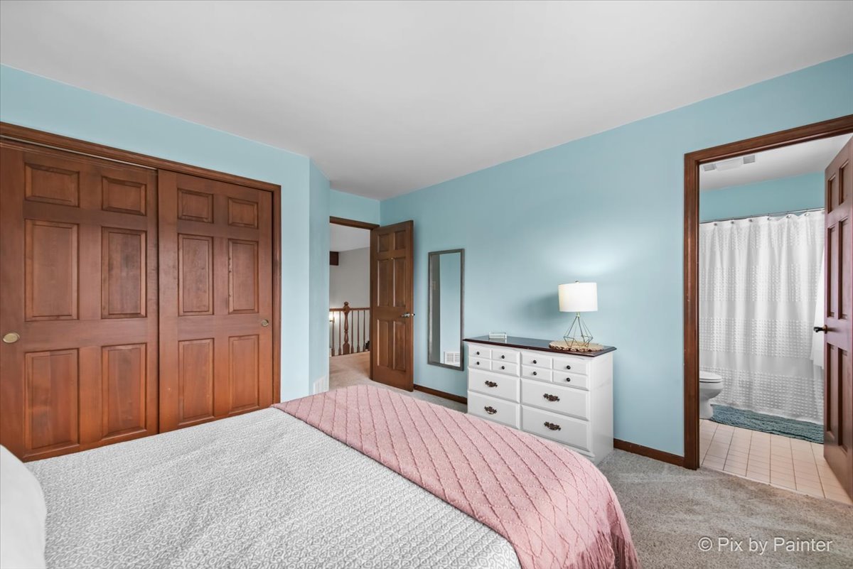 3910 Tecoma Drive Crystal Lake, IL 60012 - Photo 37 of 54 a bedroom with a bed and a dresser