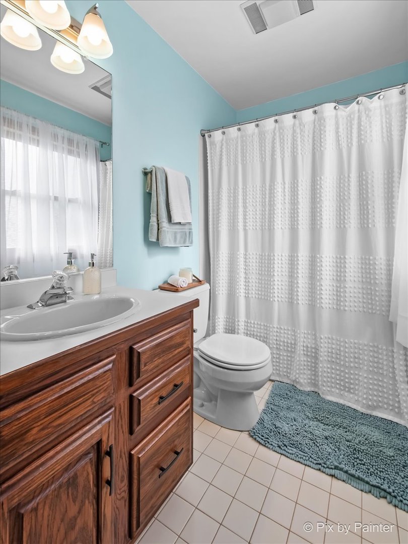 3910 Tecoma Drive Crystal Lake, IL 60012 - Photo 38 of 54 a bathroom with a sink a toilet and shower