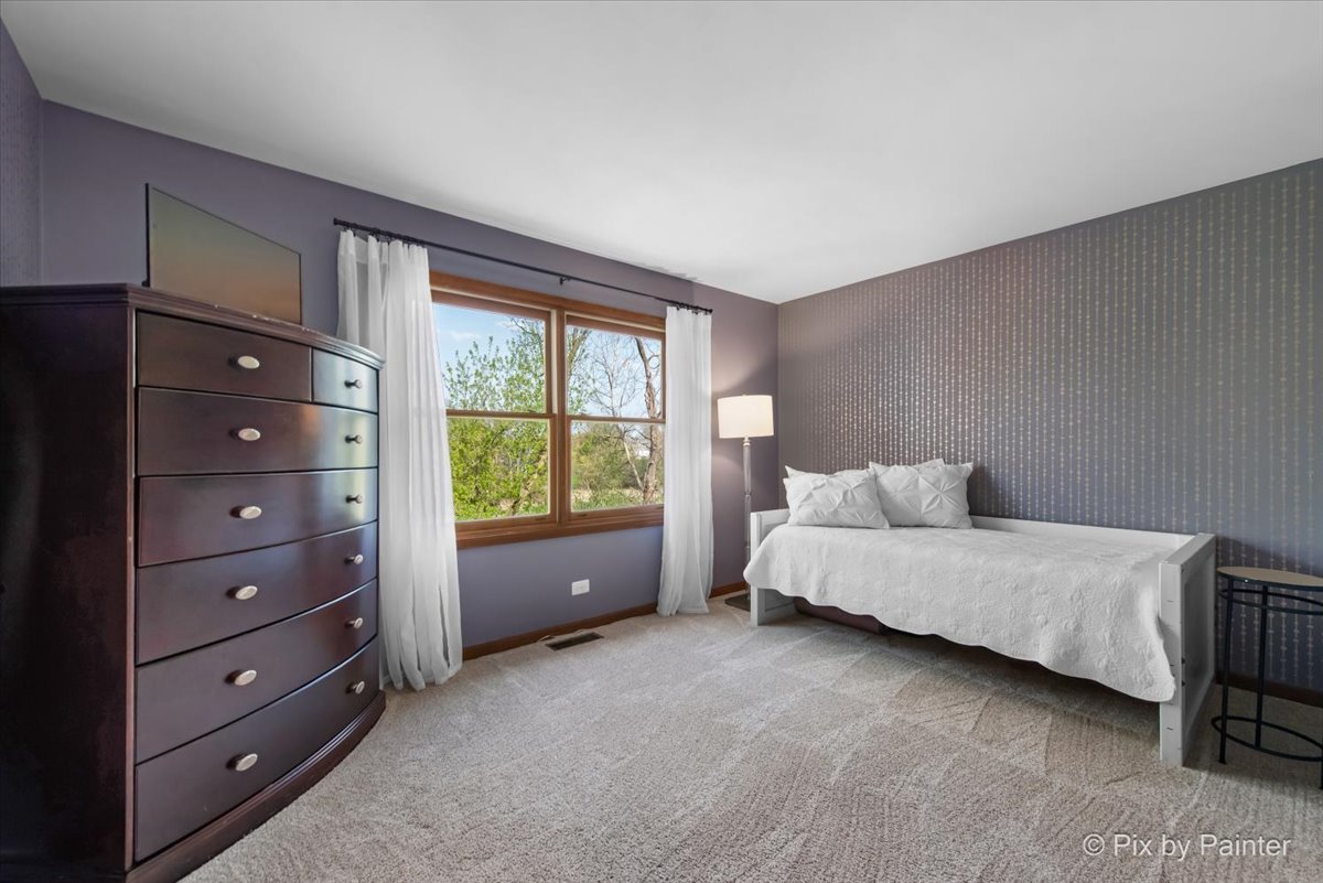 3910 Tecoma Drive Crystal Lake, IL 60012 - Photo 39 of 54 a spacious bedroom with a bed and a window