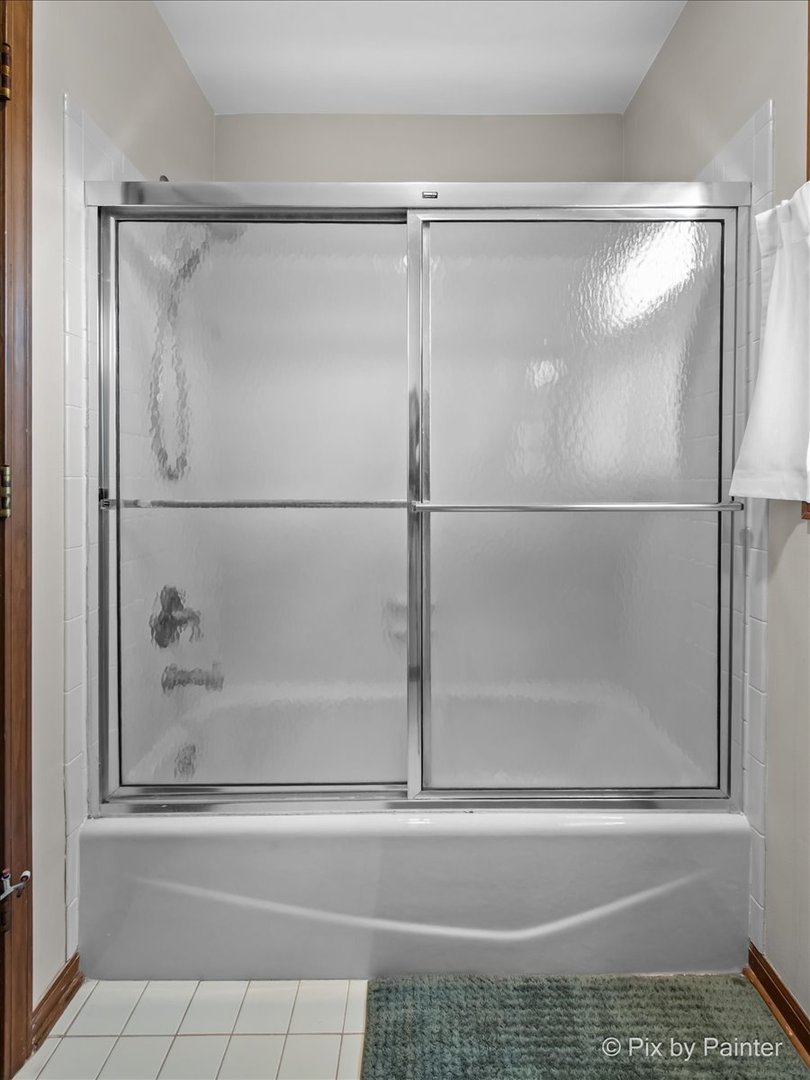 3910 Tecoma Drive Crystal Lake, IL 60012 - Photo 41 of 54 a bathroom with a glass shower door