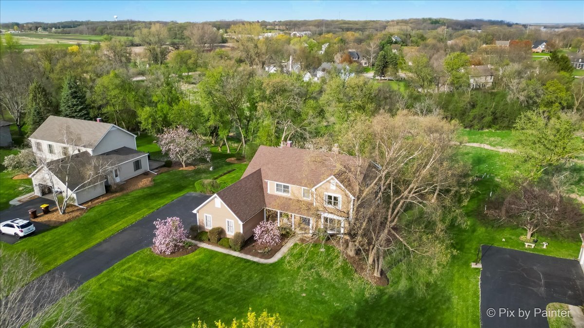 3910 Tecoma Drive Crystal Lake, IL 60012 - Photo 45 of 54 an aerial view of residential houses with outdoor space and trees