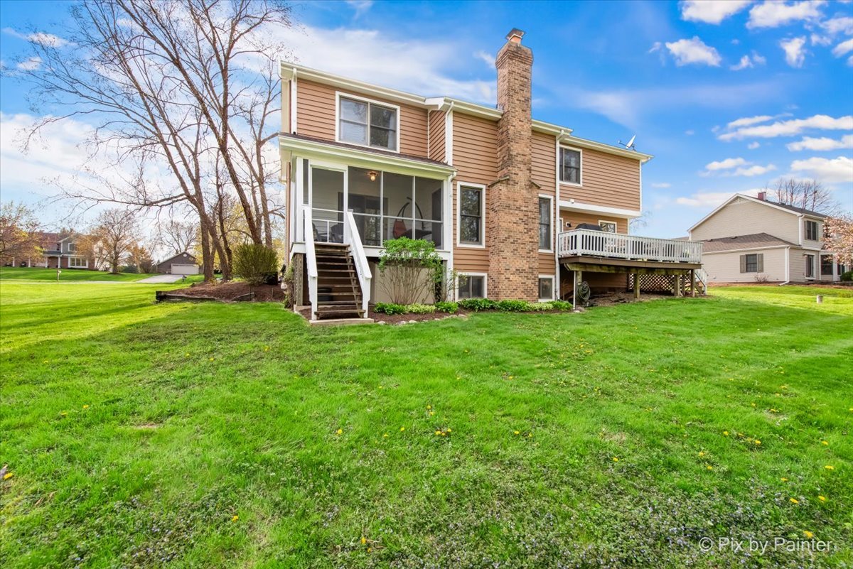3910 Tecoma Drive Crystal Lake, IL 60012 - Photo 6 of 54 a view of a house with a yard and sitting area