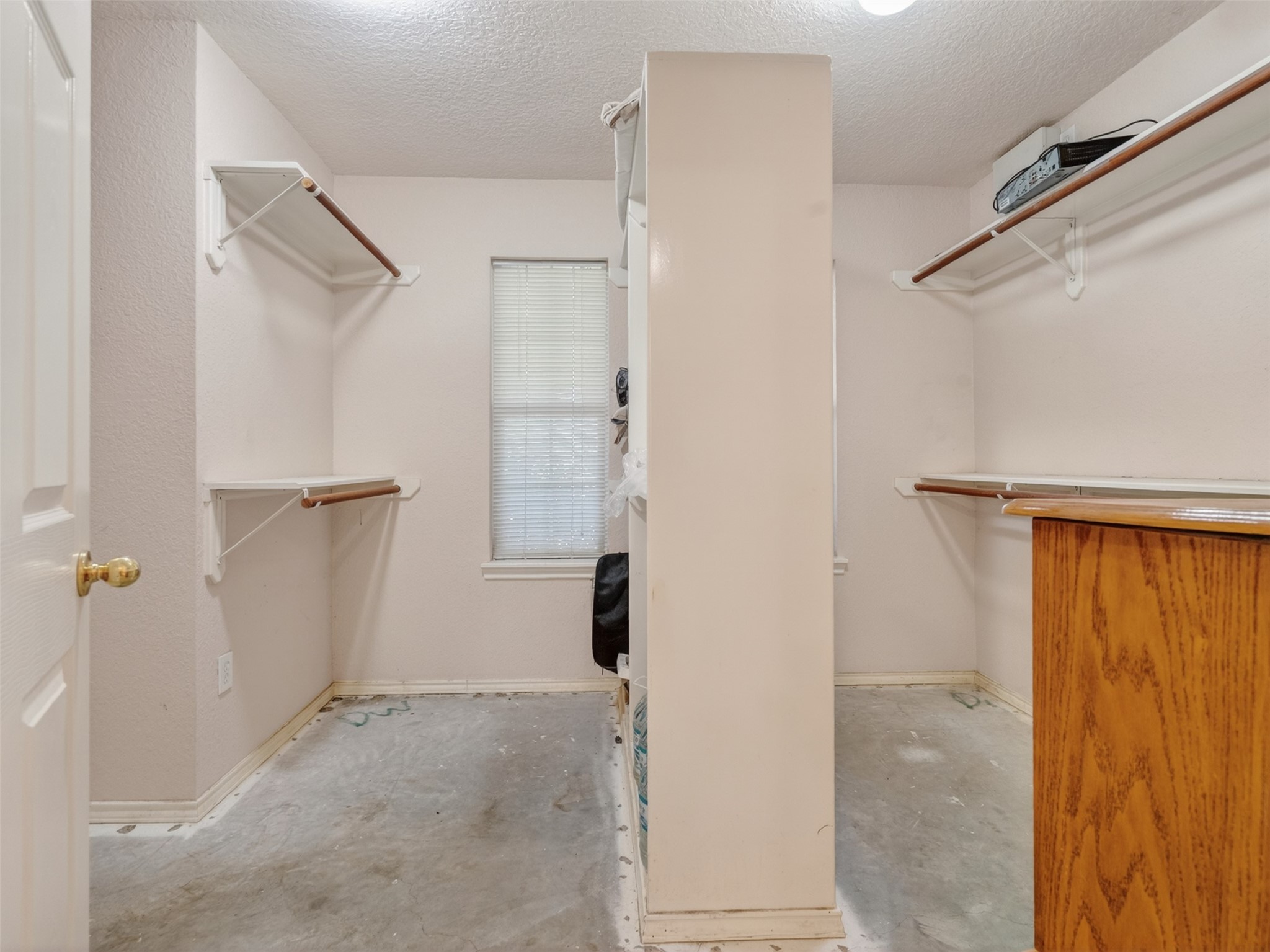 5036 Singletary Road Alvin, TX 77511 - Photo 13 of 35 Large walk-in closet with built-in shelving and ample storage space.