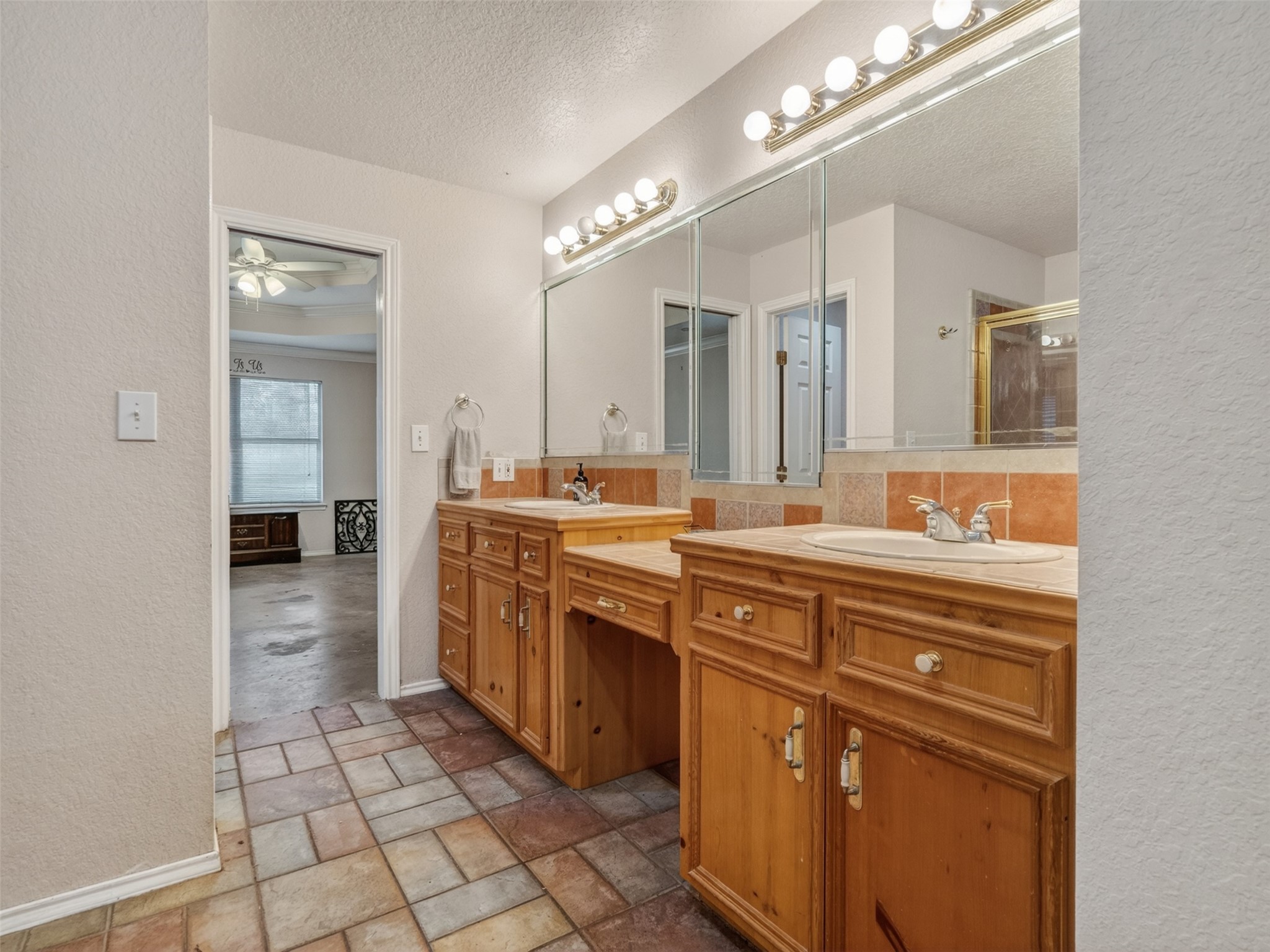 5036 Singletary Road Alvin, TX 77511 - Photo 14 of 35 Dual sink vanity with plenty of storage and counter space for everyday convenience.
