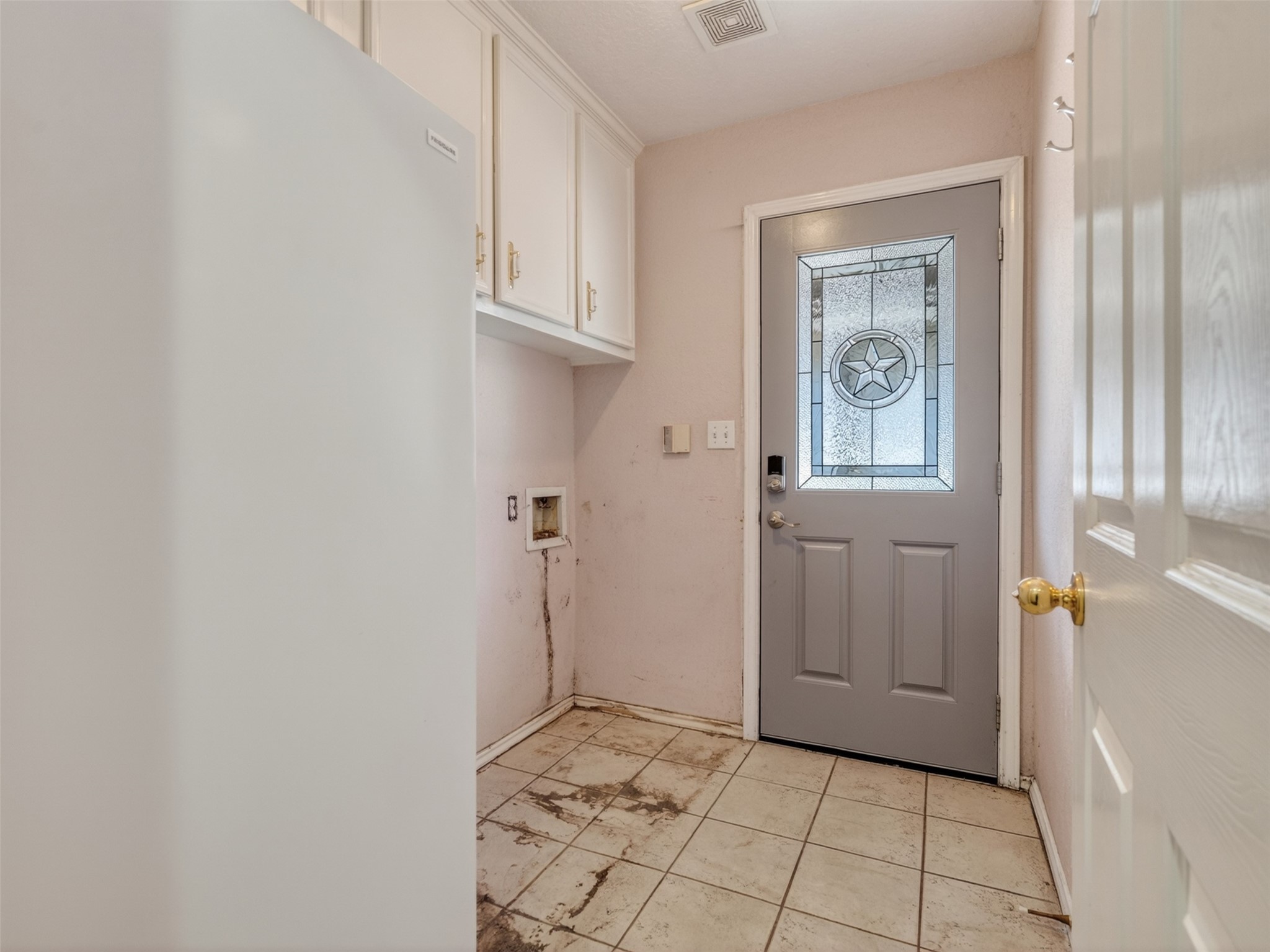 5036 Singletary Road Alvin, TX 77511 - Photo 22 of 35 Functional utility space with storage cabinets and exterior access for added convenience.