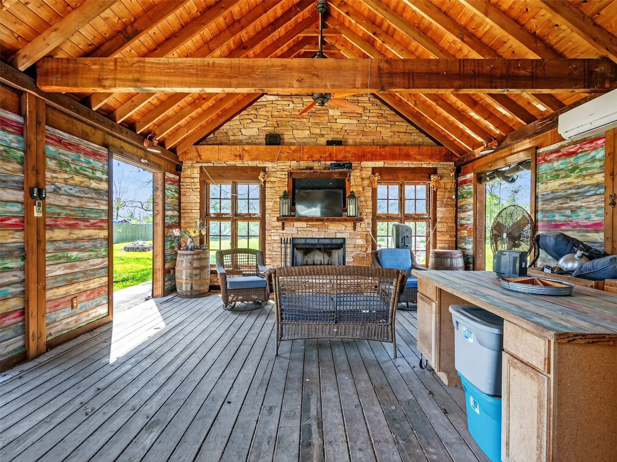 5036 Singletary Road Alvin, TX 77511 - Photo 28 of 35 Inviting outdoor entertaining space with open layout, fireplace focal point, and plenty of seating room.