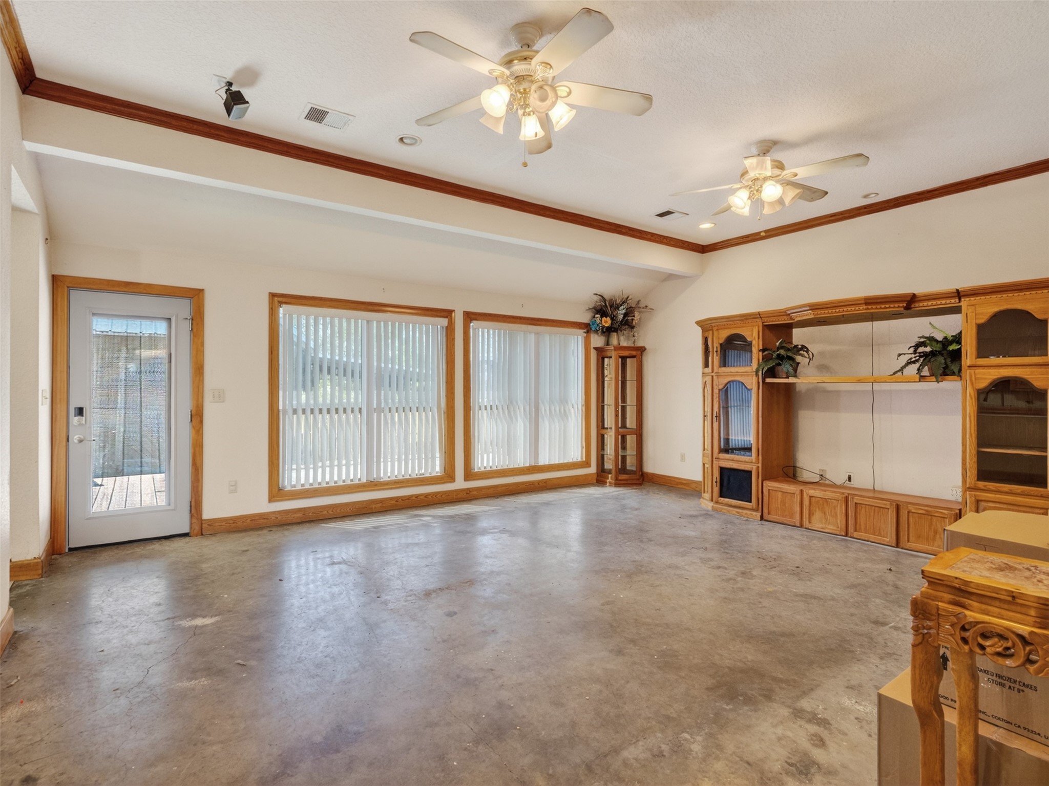 5036 Singletary Road Alvin, TX 77511 - Photo 3 of 35 Expansive living area featuring large windows, abundant natural light, and open space perfect for entertaining.